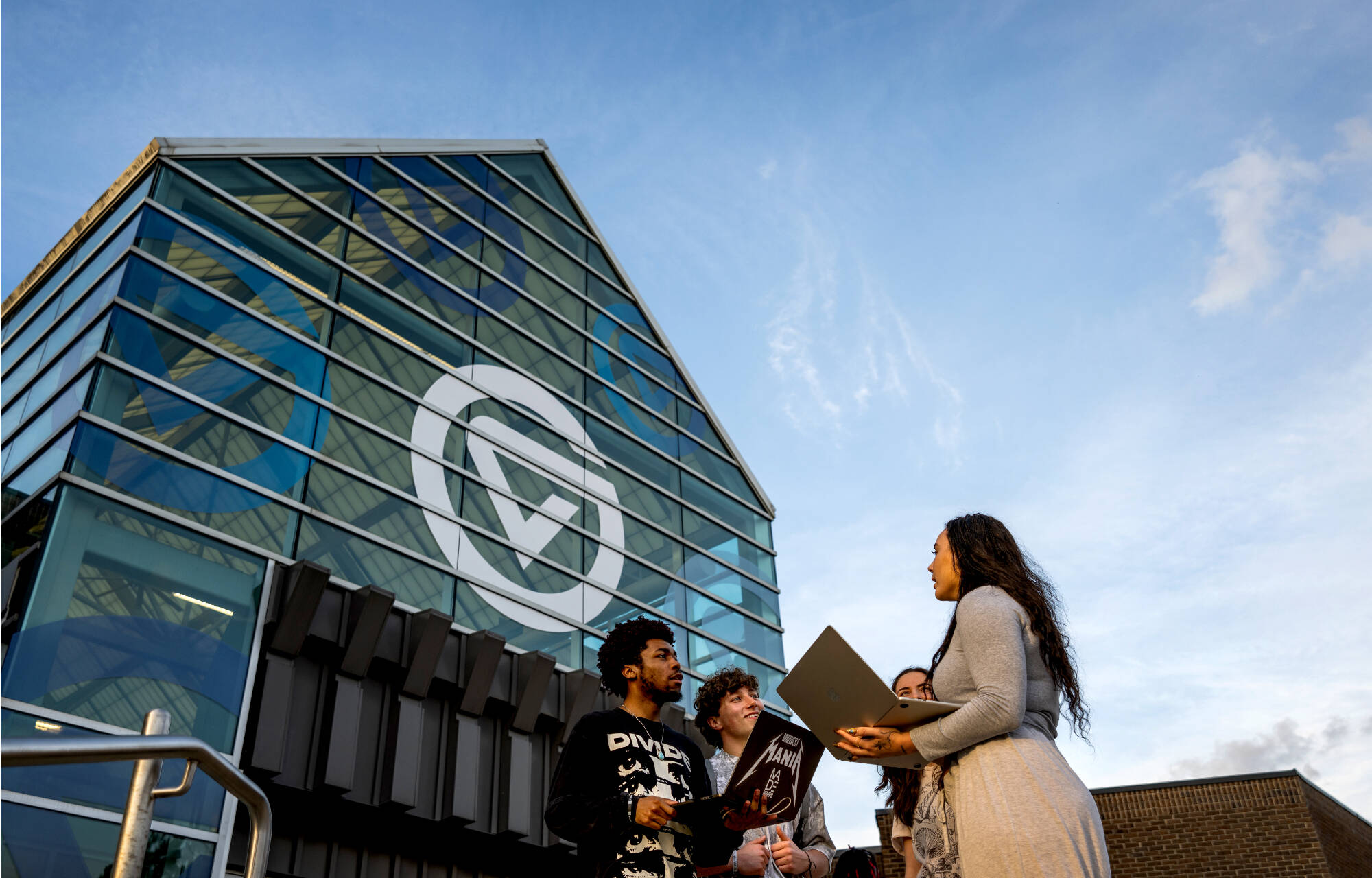 From left, senior multimedia journalism student Jacob Wooten, sophomore journalism broadcast media student Isaac Gallé, senior writing student Lillian Reiner and senior multimedia journalism and political science student Rachel Mayfield enjoy a warm e...